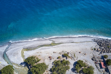 Aerial drone view of Agia Roumeli beach in Chania of Crete, Greece. The village of Agia Roumeli is...