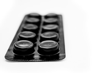 black blister with pills on a white background