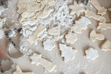 messy table with flour, cookie cutters Home comfort and cooking, preparing for New year, christmas, holiday, festive time, preparation for a party