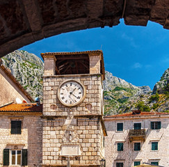 Fototapeta na wymiar 17th century Clock Tower on Arms Square - main square of historic part of Kotor city