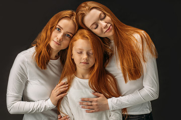 nice caucasian redhead girls isolated over black background. beautiful girls with natural red hair...