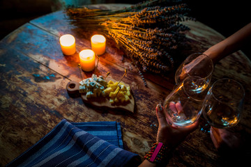 feast with friends cheese, wine and candles