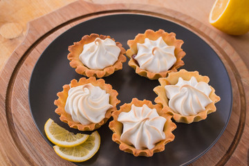 Mini pies with lemon meringue ready to serve.