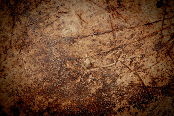 Rusty metal texture grunge background with old dirty brown stain pattern on damaged steel wall surface.