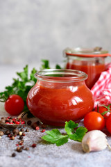 Homemade spicy tomato ketchup in a vintage jars.