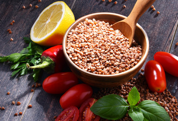 Bowl of buckwheat kasha on wooden table