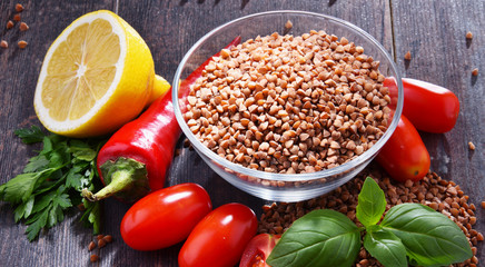 Bowl of buckwheat kasha on wooden table