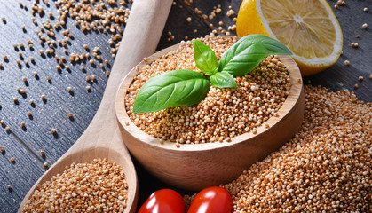 Bowl of amaranth grain on wooden table