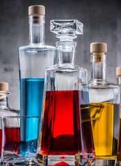 Carafe and bottles of assorted alcoholic beverages.