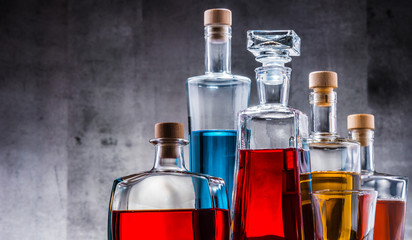 Carafe and bottles of assorted alcoholic beverages.