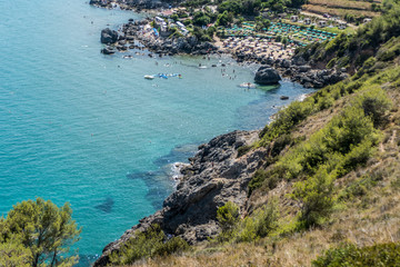 Obraz na płótnie Canvas Aerial view of a beach of Porto Ercole with clear blue water