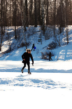 Russia, Moscow region, Grebnevo 08 February, 2020: Ice skater. Barsky pond Rink. Winter sunny day