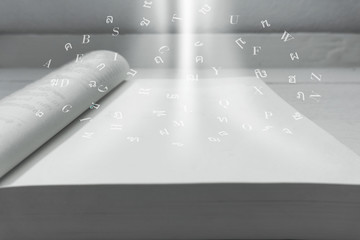 Obraz premium The miracle of knowledge book Of letters, concepts, knowledge with soft blur white
