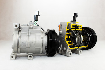 New car compressor with cutted car compressor on white background