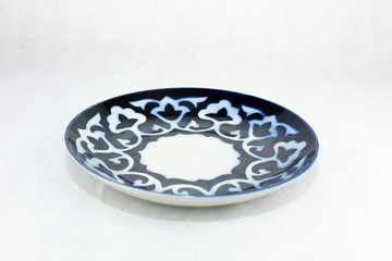 White plate with east traditional blue ornament