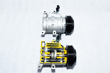 New car compressor with cutted car compressor on white background
