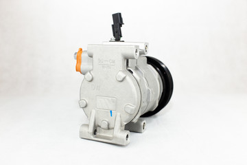New car air conditioning compressor on white background