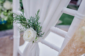 Decorated chair white rose for wedding party