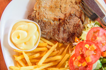 Top view of Pork steak in dish