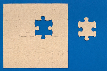 puzzle with a missing element on a blue background