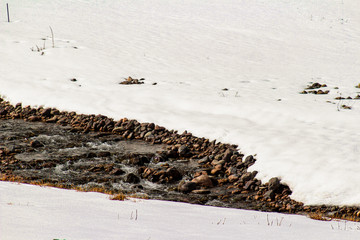 Natural Monument El Morado Park, in Cajón del Maipo, central andes of Chile. Snowy and rocky mountains in the national park.