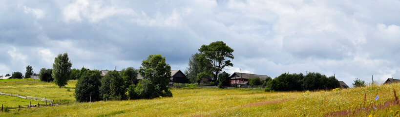 landscape with green field and blue sky