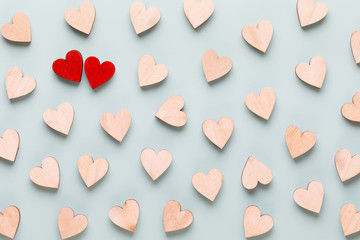 Happy Valentines day background. red hearts on white wooden background.