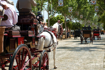 horses and carriages at the feria de Abril - obrazy, fototapety, plakaty