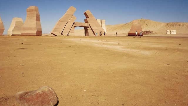 People taking photos near Gate of Allah. Bus tour to Ras Mohammed national park in Egypt, southern extreme of Sinai peninsula. Road, desert, people, tourists and buses 4k