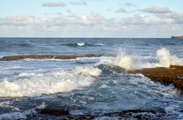 waves crashing on rocks