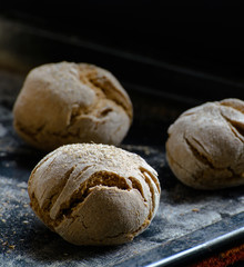 freshly baked bread on the dark table