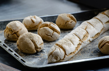 freshly baked bread on the dark table