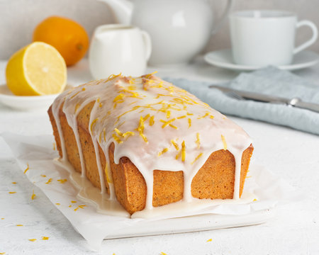 Lemon bread coated with sugar sweet. Cake with citrus, Whole loaf, side view, close up, vertical