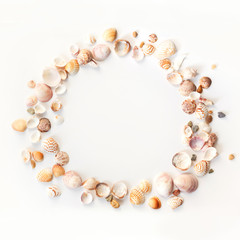 seashells and sea stones round frame isolatred on white background.