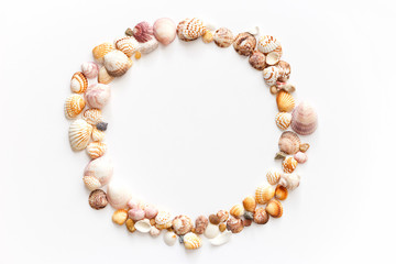 seashells and sea stones round frame isolatred on white background.