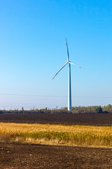 Air turbines that produce electrical energy on a Sunny morning on an autumn day.