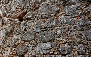 Background of an old stone wall of gray color