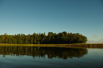 Fototapeta na wymiar Lake with island and forest