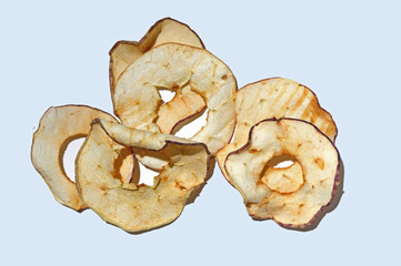 sliced dried apples on a white background. top view.