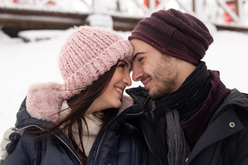 happy young couple enjoying the day in a cold winter