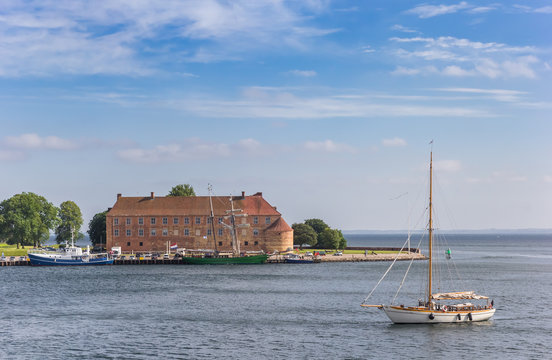 Old wooden sailing ship in front of the castle in Sonderborg, Denmark