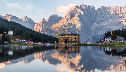 Incredible nature landscape. Great view on Fairy tale lake in Dolomites alps. Beautiful landscape of alpine lake with crystal clear water. A magnificent panorama of the mountains valley.