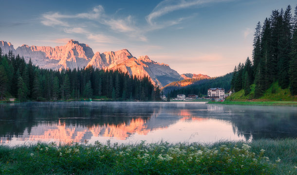 Awesome nature landscape. Fantastic caln lake Misurina during sunset. Wonderful evening view on majestic Dolomites alp mountains under sunlight, Amazing natural background. Picture of wild area.
