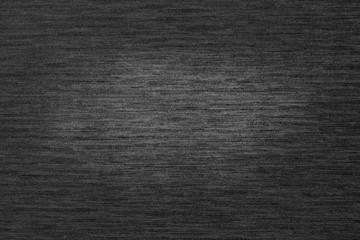 Dark texture with horizontal lines and a bright area in the center