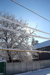 Winter wires. Snow-covered power grids.