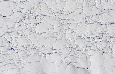 Old cracked white rubber textures in a textile 