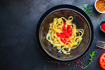 pasta tagliatelle tomato sauce (delicious main course) menu concept. background. top view. copy space