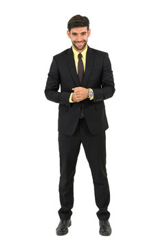 Handsome confident businessman standing and smiling, isolated on white background