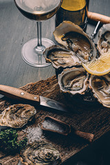 Fresh oysters with lemon ice and white wine.