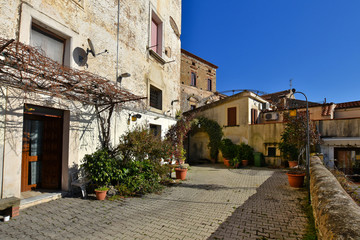 Pisciotta, Italy, 02/15/2020. A narrow street between the old houses of a medieval village in...